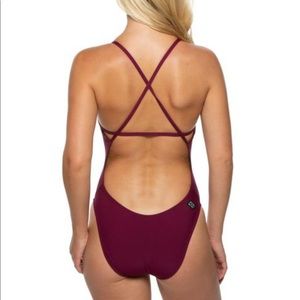 reddish/purplish Jolyn onesie swim suit